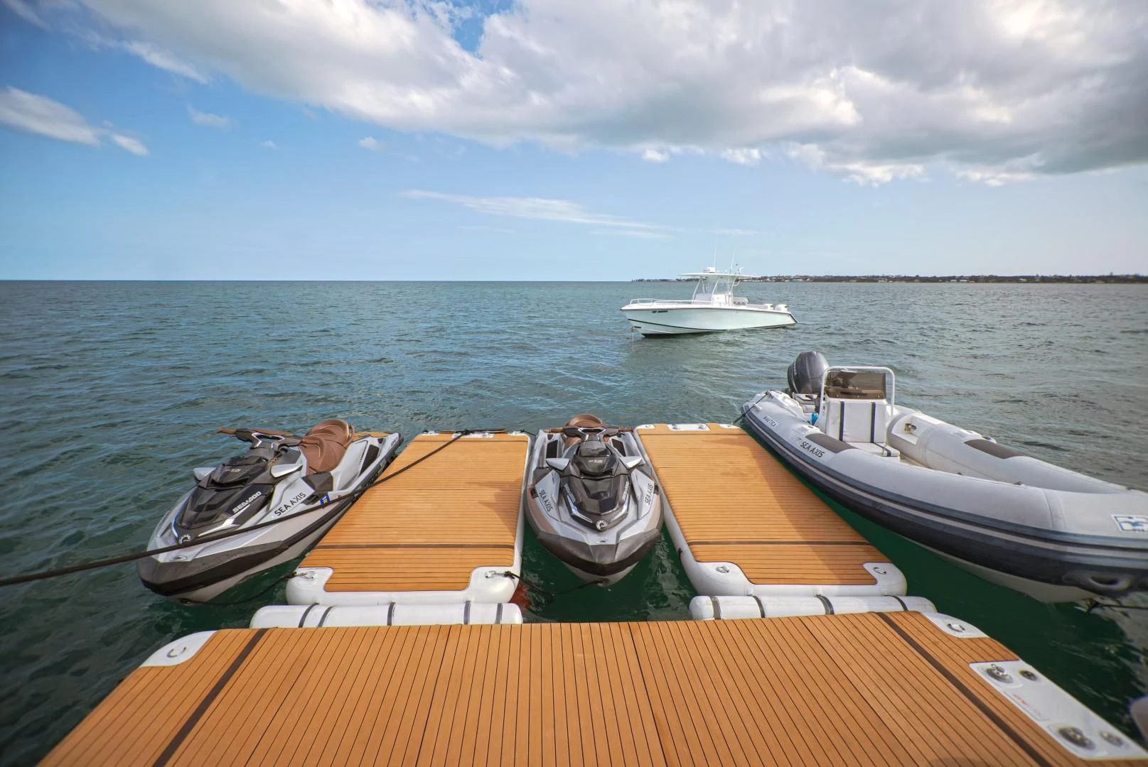 a couple of boats sit on a dock aboard SEA AXIS Yacht for Charter