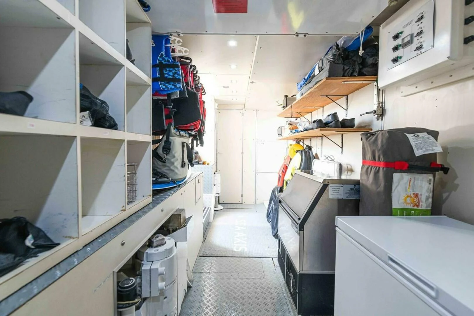 a room with shelves and equipment aboard SEA AXIS Yacht for Charter