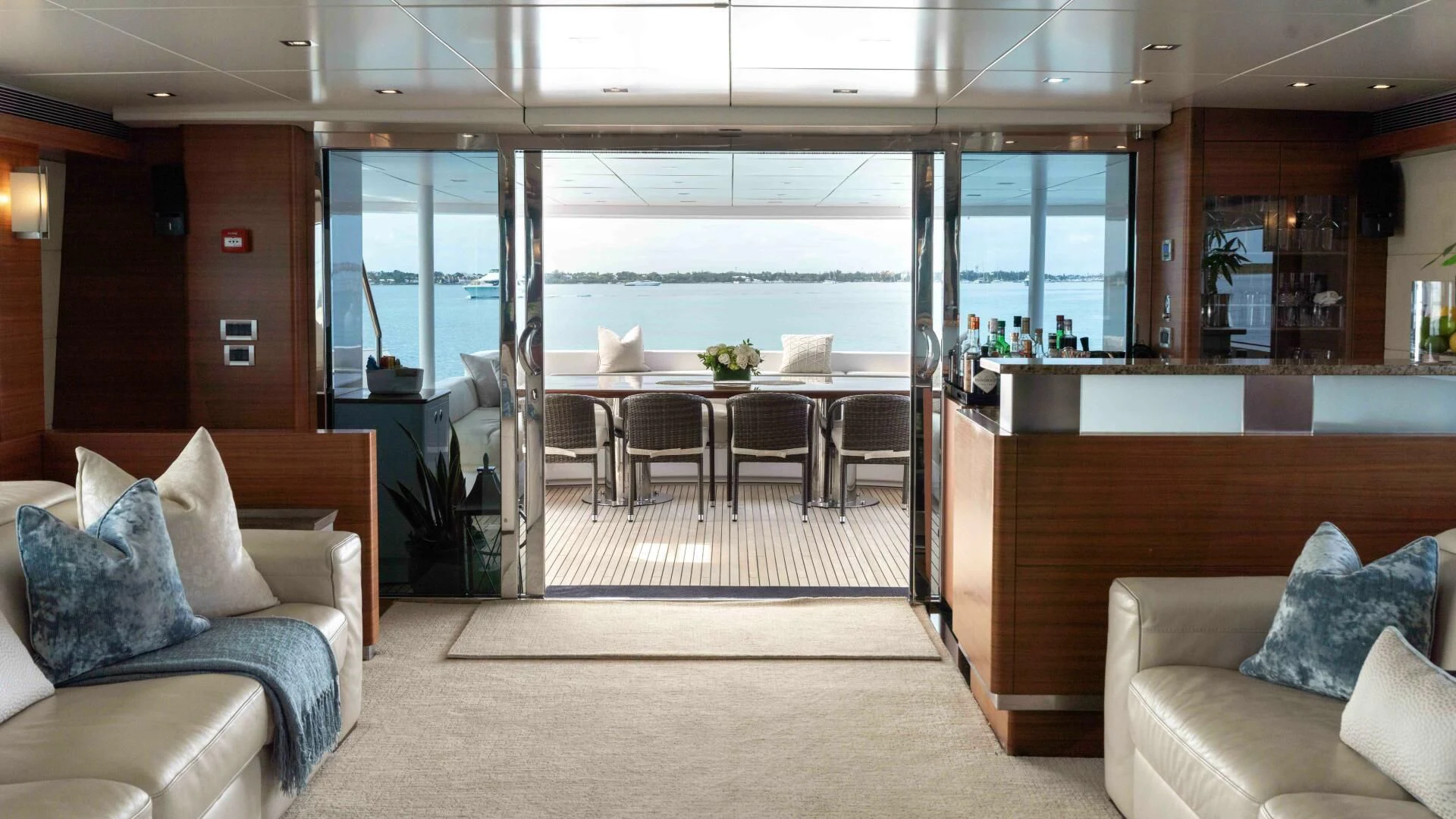 a room with a couch and a table and chairs aboard SEA AXIS Yacht for Charter