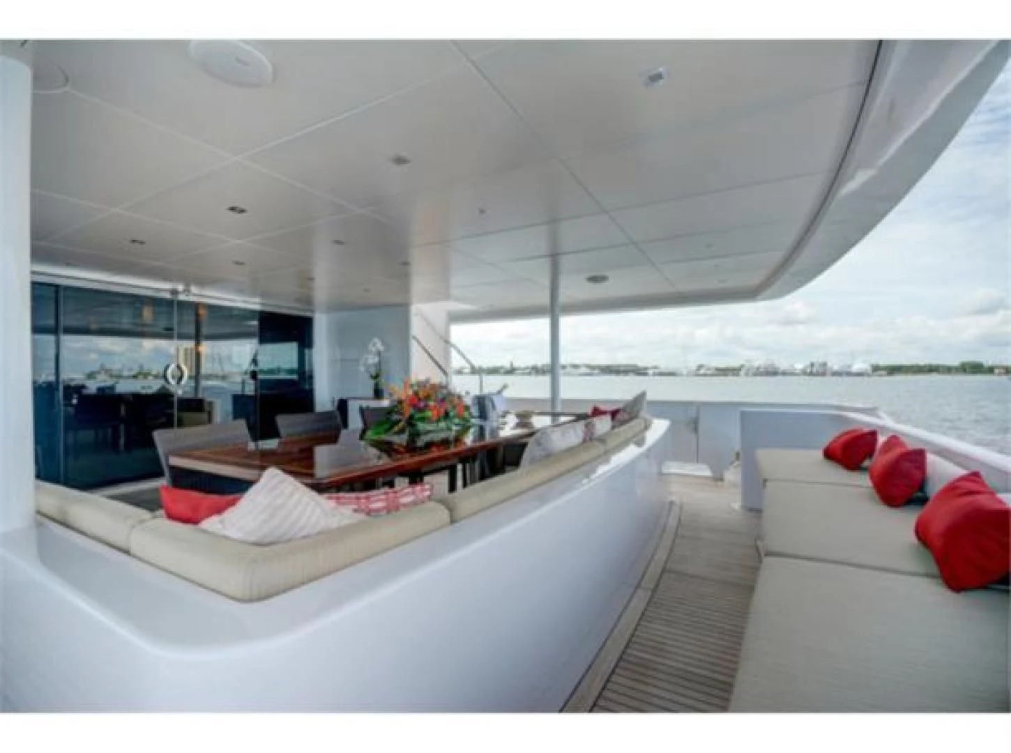 a room with a view of the ocean and the deck aboard SEA AXIS Yacht for Charter