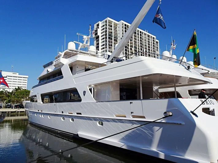 a white boat with flags on it aboard SEA AXIS Yacht for Charter