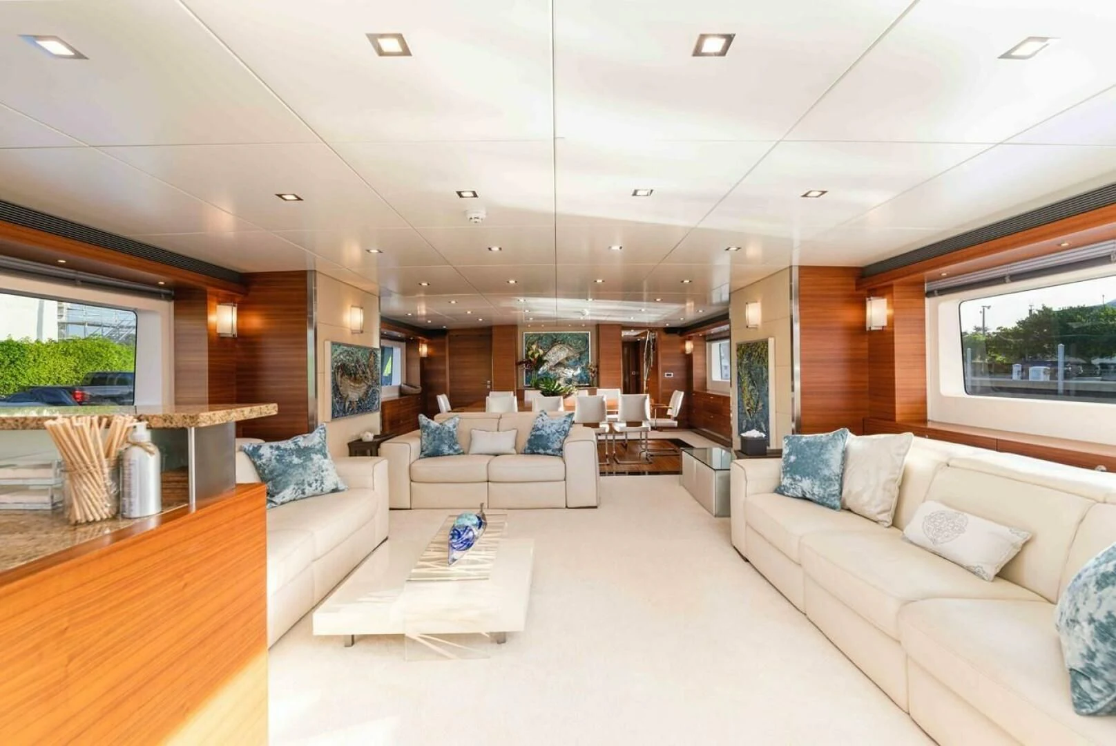 a living room with a large window aboard SEA AXIS Yacht for Charter