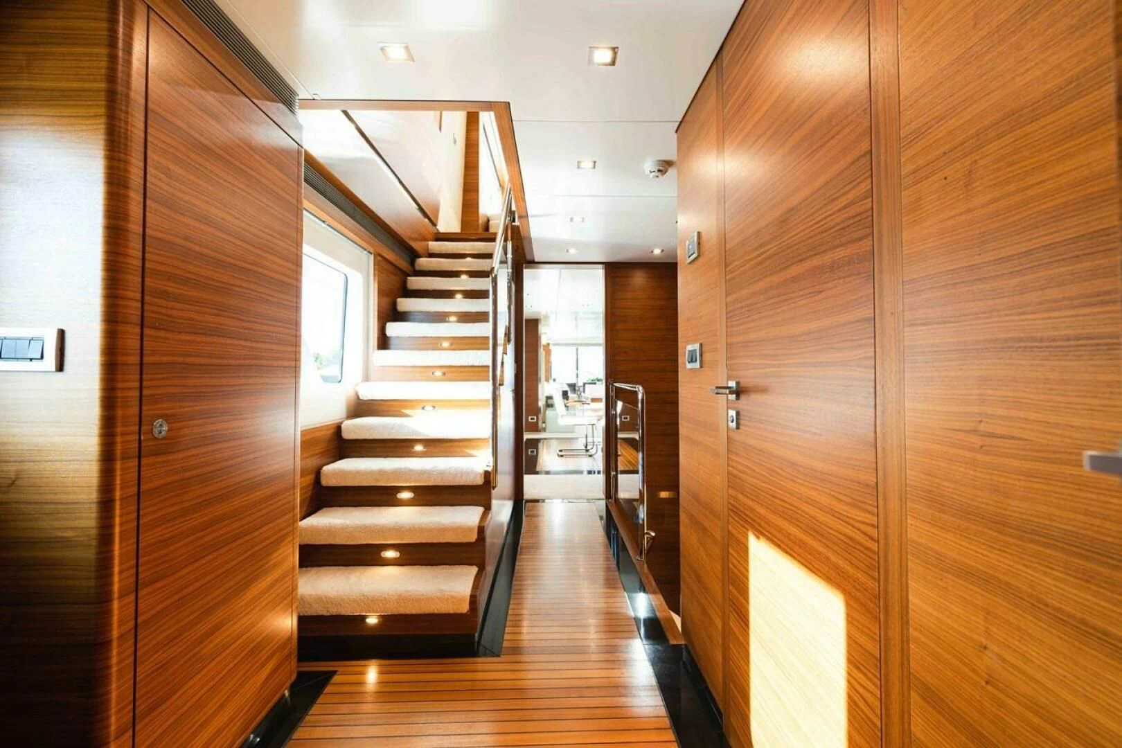 a wooden staircase in a house aboard SEA AXIS Yacht for Charter