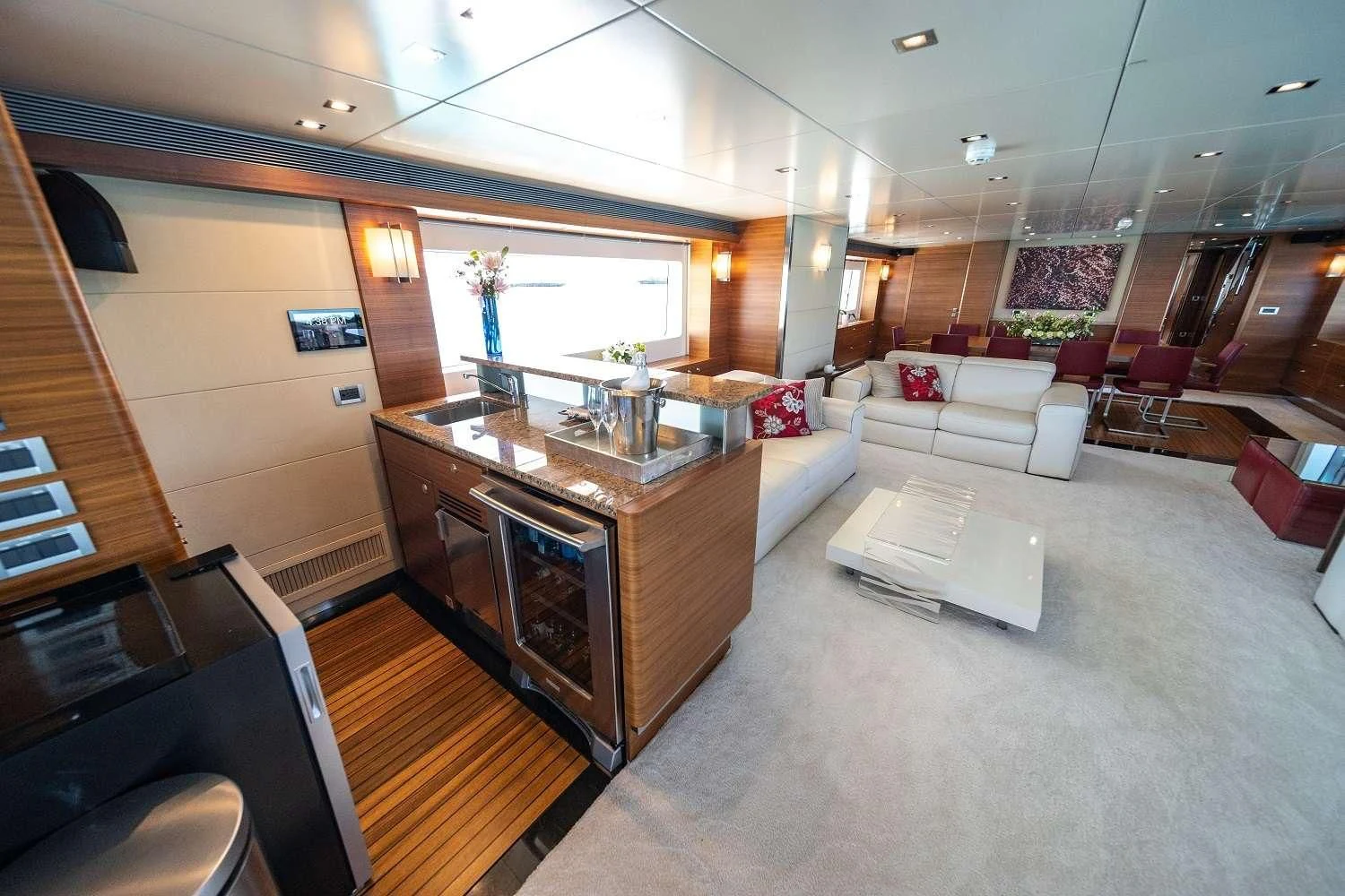 a living room with a large kitchen and a large island aboard SEA AXIS Yacht for Charter