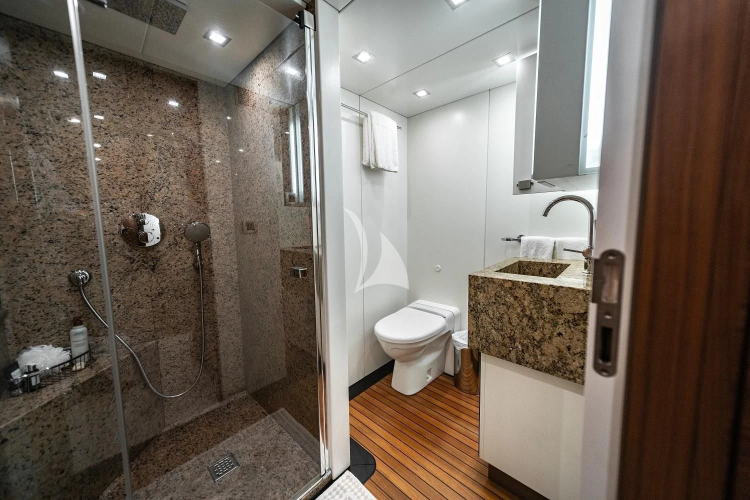 a bathroom with a marble counter top aboard SEA AXIS Yacht for Charter