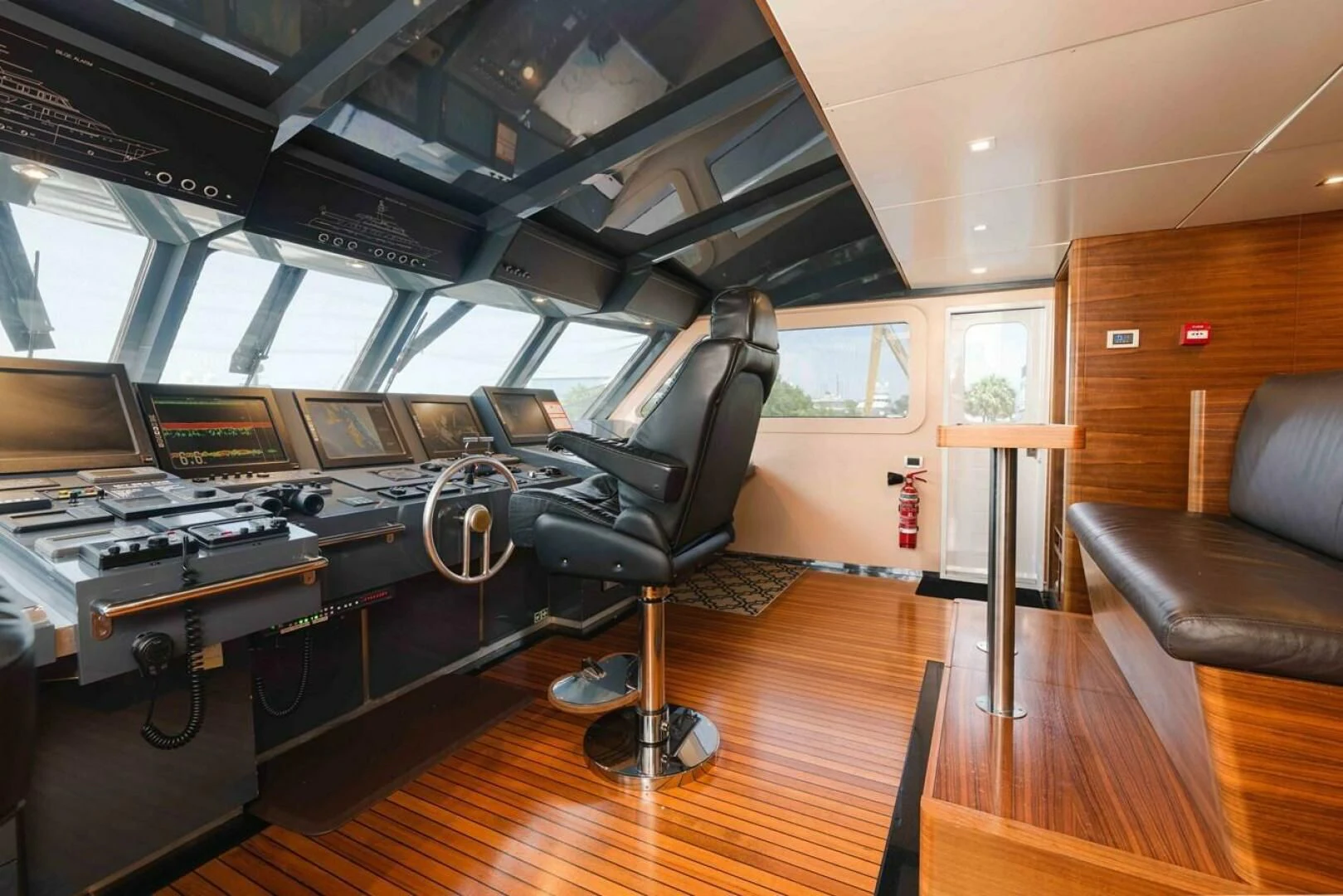 a room with a large table and chairs aboard SEA AXIS Yacht for Charter