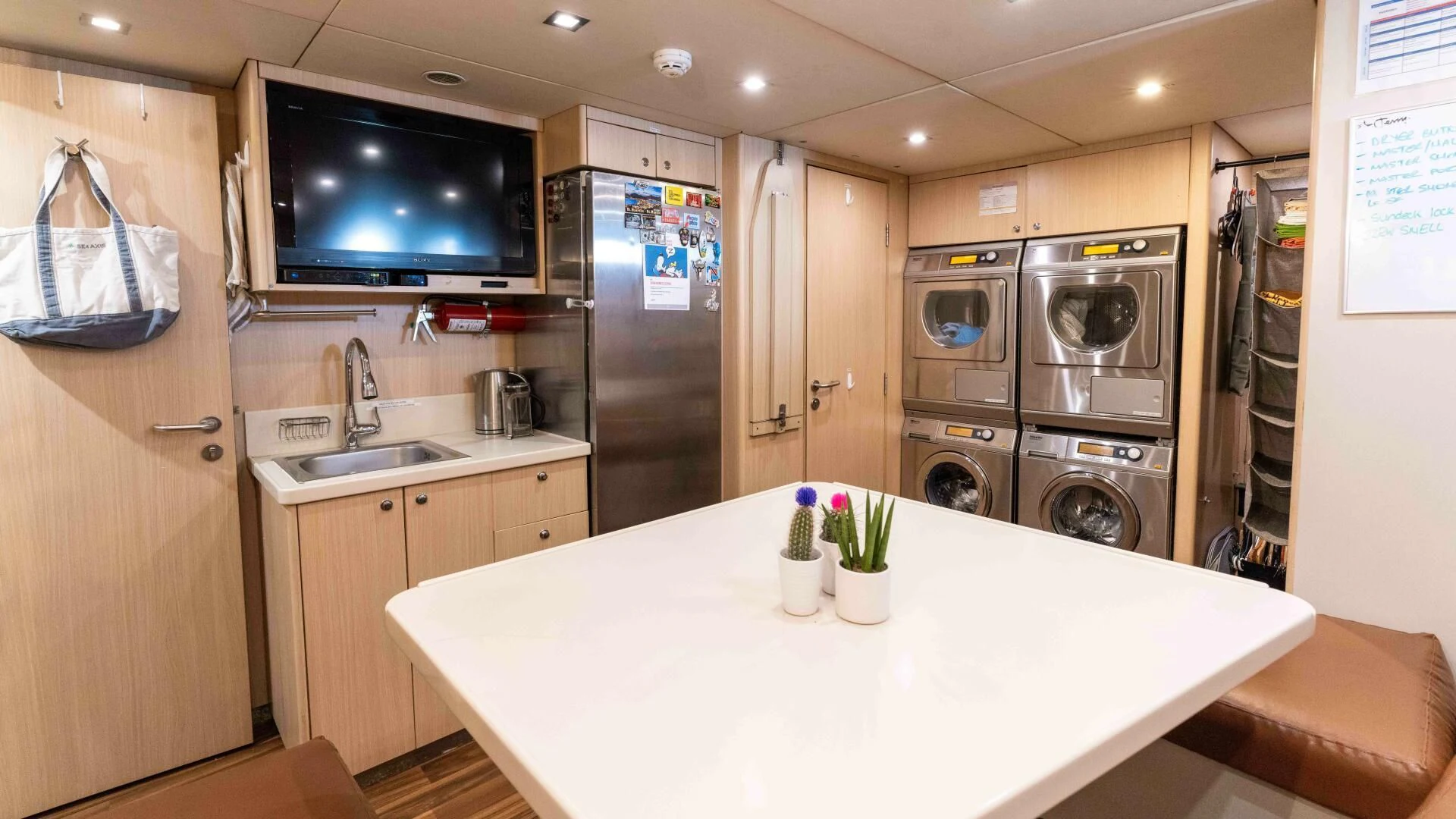 a kitchen with a large island aboard SEA AXIS Yacht for Charter