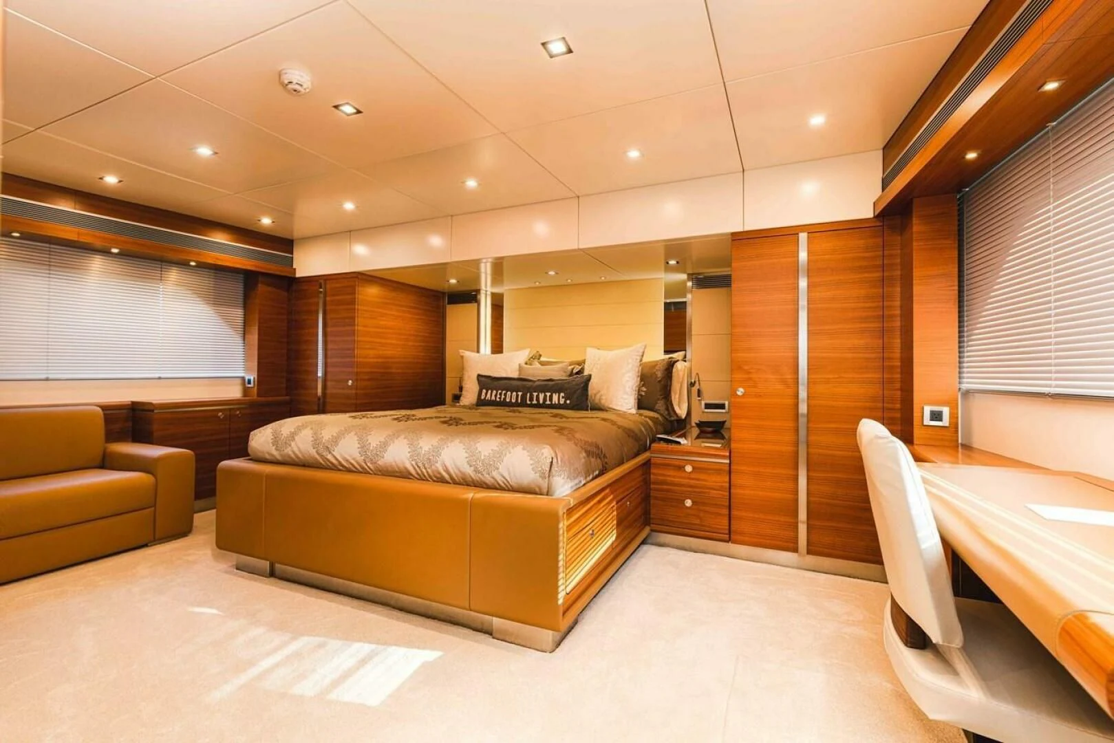 a living room with a couch and a tv aboard SEA AXIS Yacht for Charter