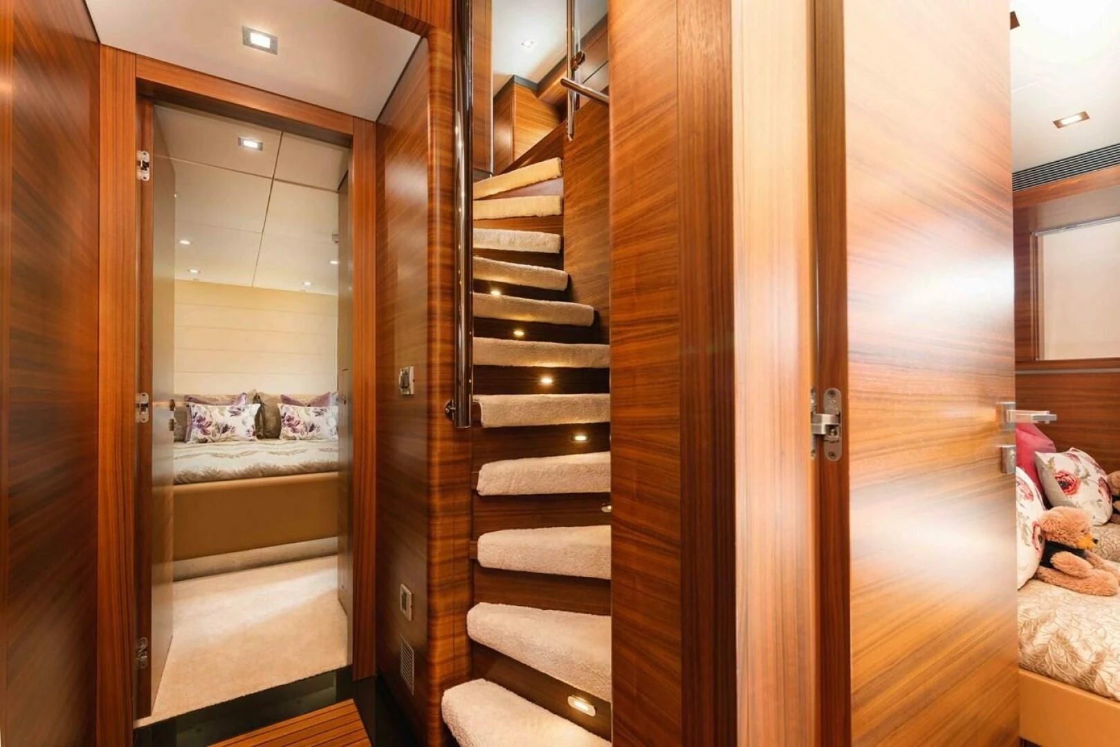 a wooden staircase in a room aboard SEA AXIS Yacht for Charter