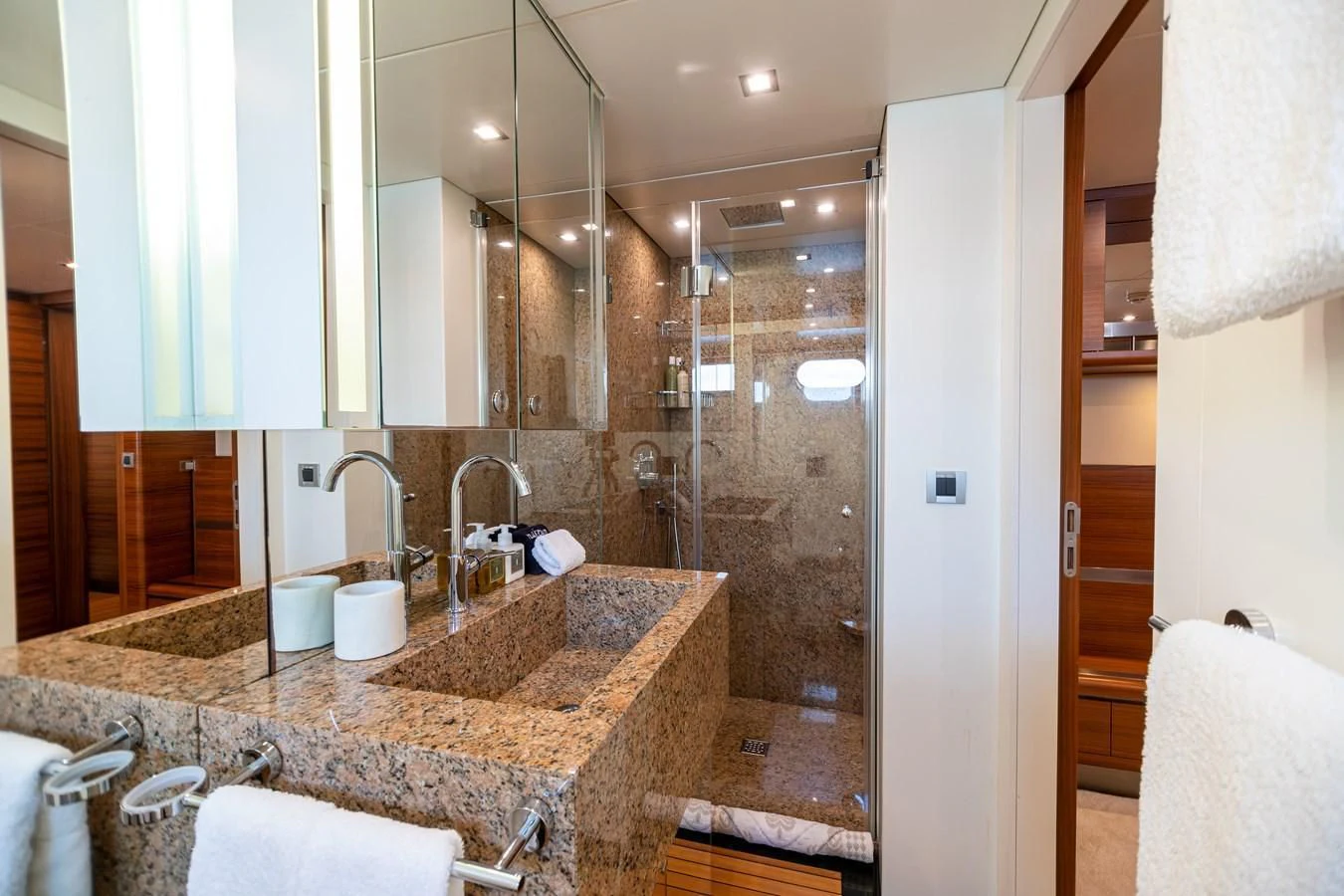 a bathroom with a marble counter top aboard SEA AXIS Yacht for Charter