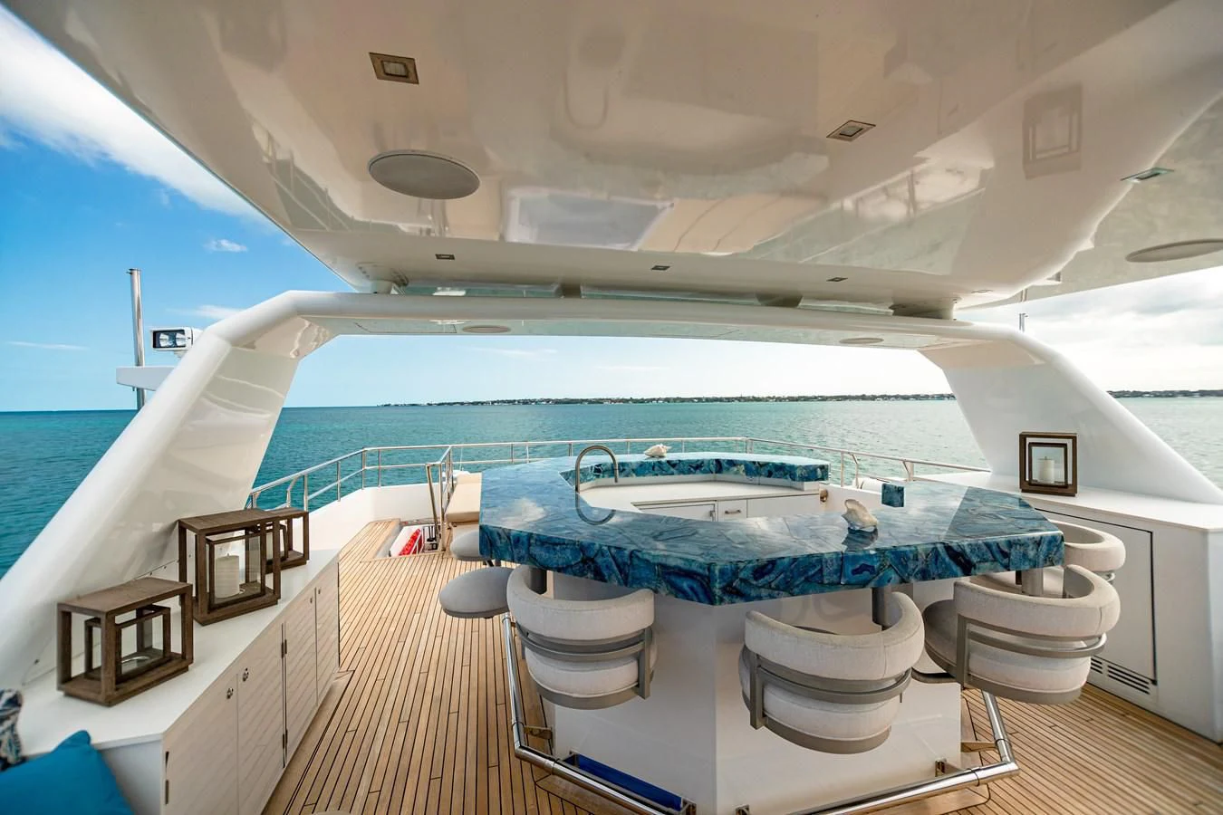 a large white boat with a deck aboard SEA AXIS Yacht for Charter