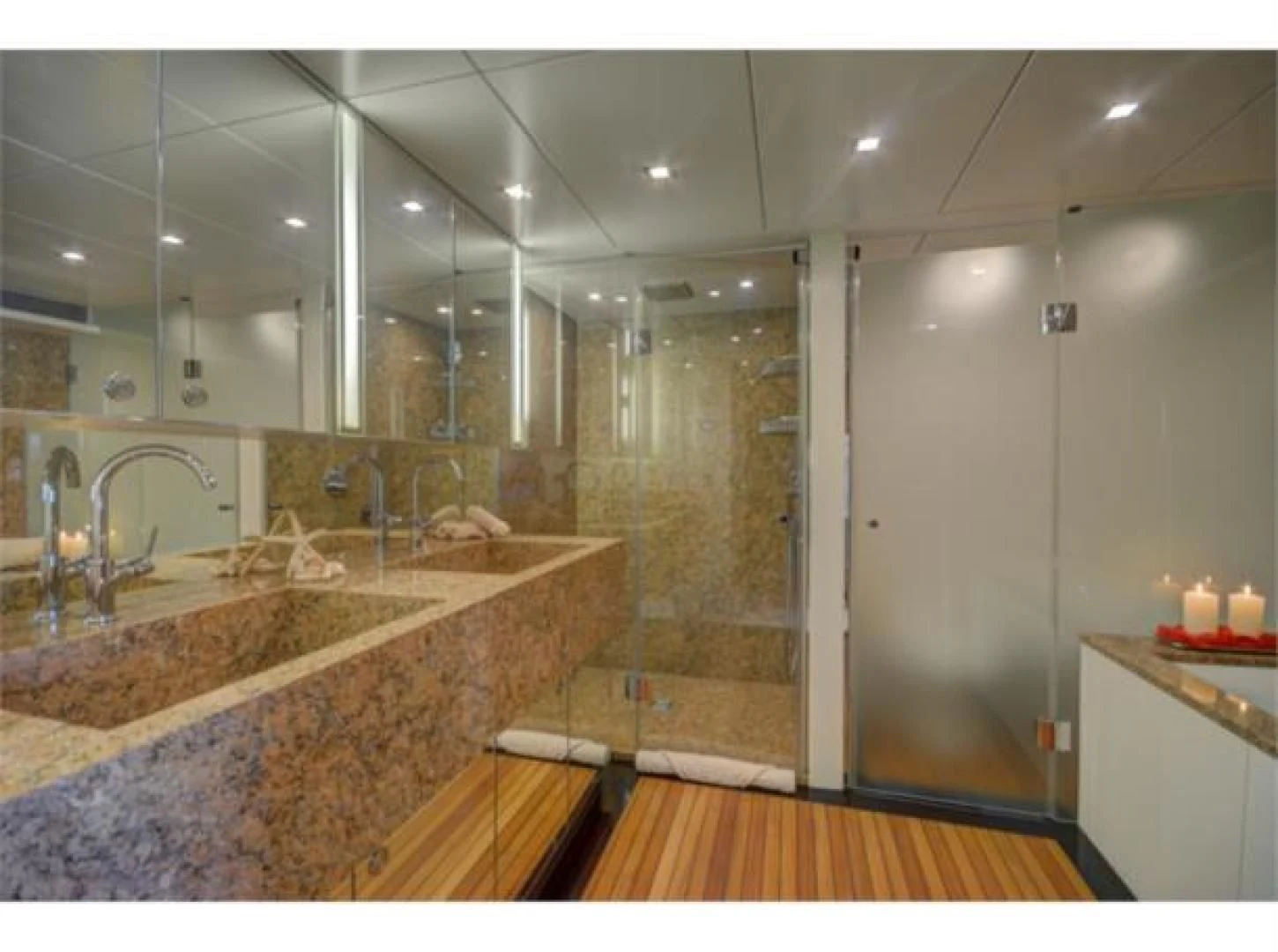 a bathroom with a large marble countertop aboard SEA AXIS Yacht for Charter