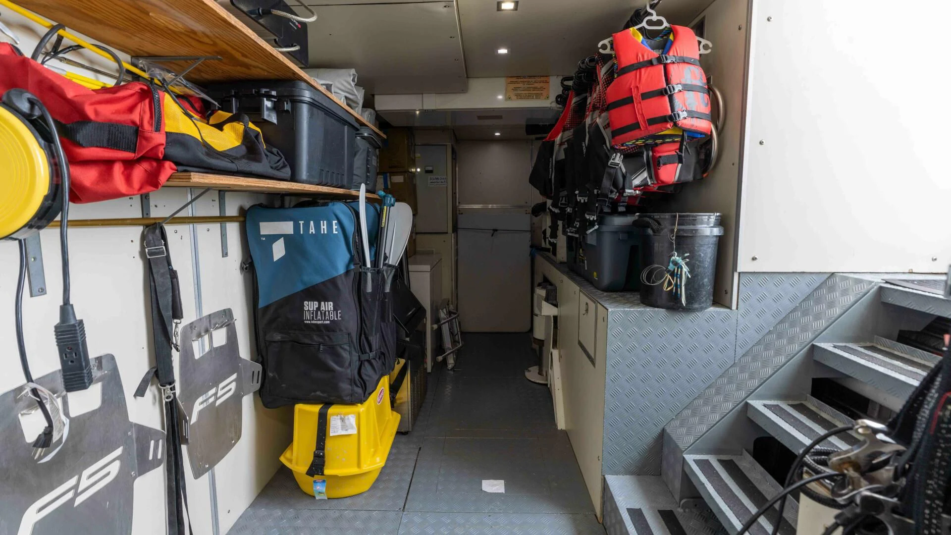 a room with shelves and equipment aboard SEA AXIS Yacht for Charter