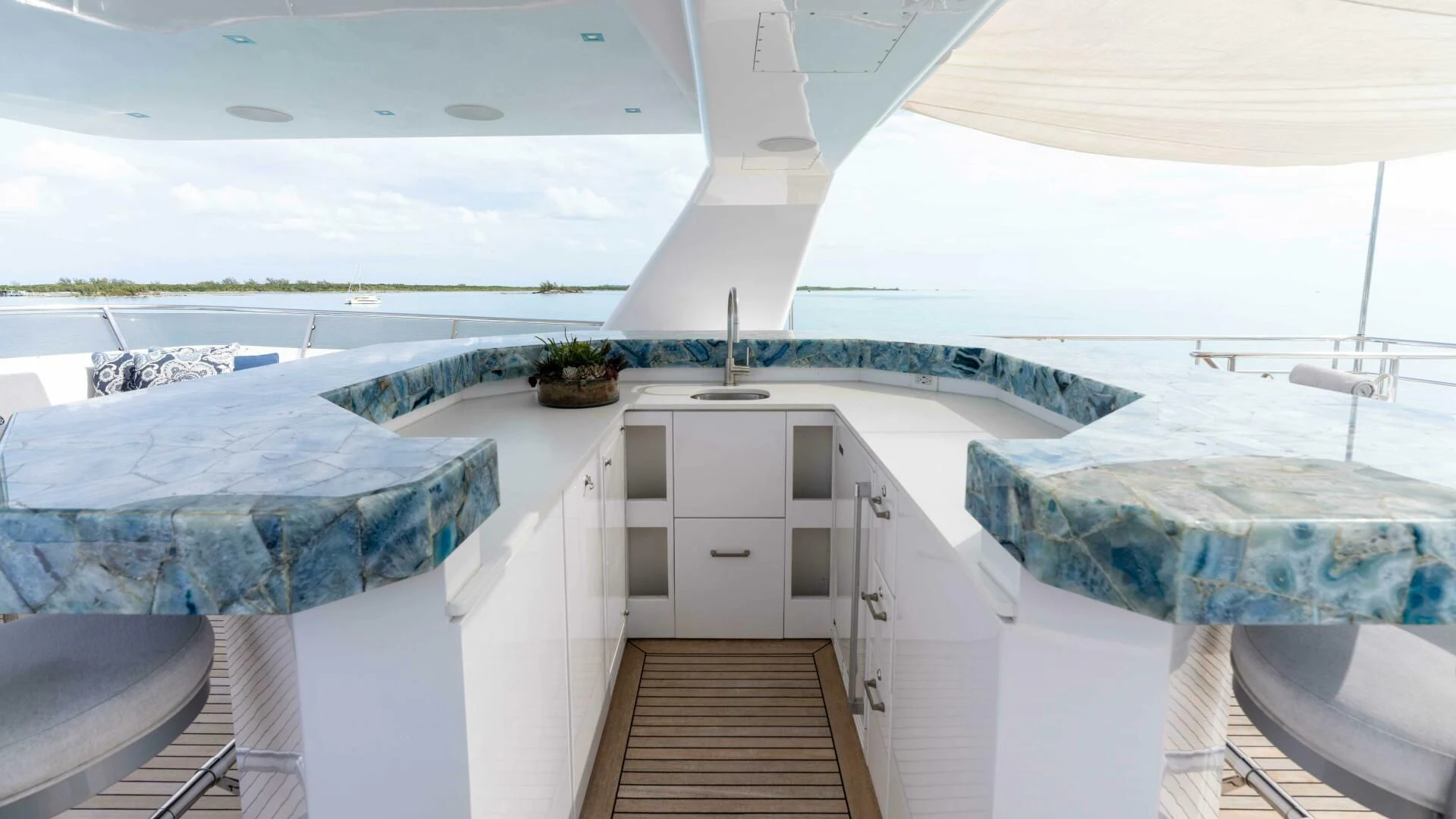 a large white room with a wooden floor and a wooden floor aboard SEA AXIS Yacht for Charter