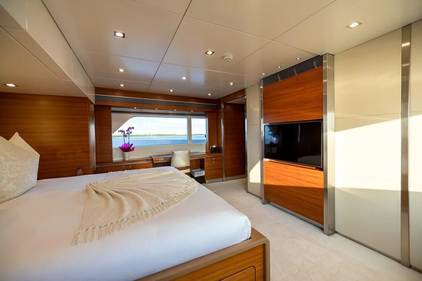 a bedroom with a large bed aboard SEA AXIS Yacht for Charter