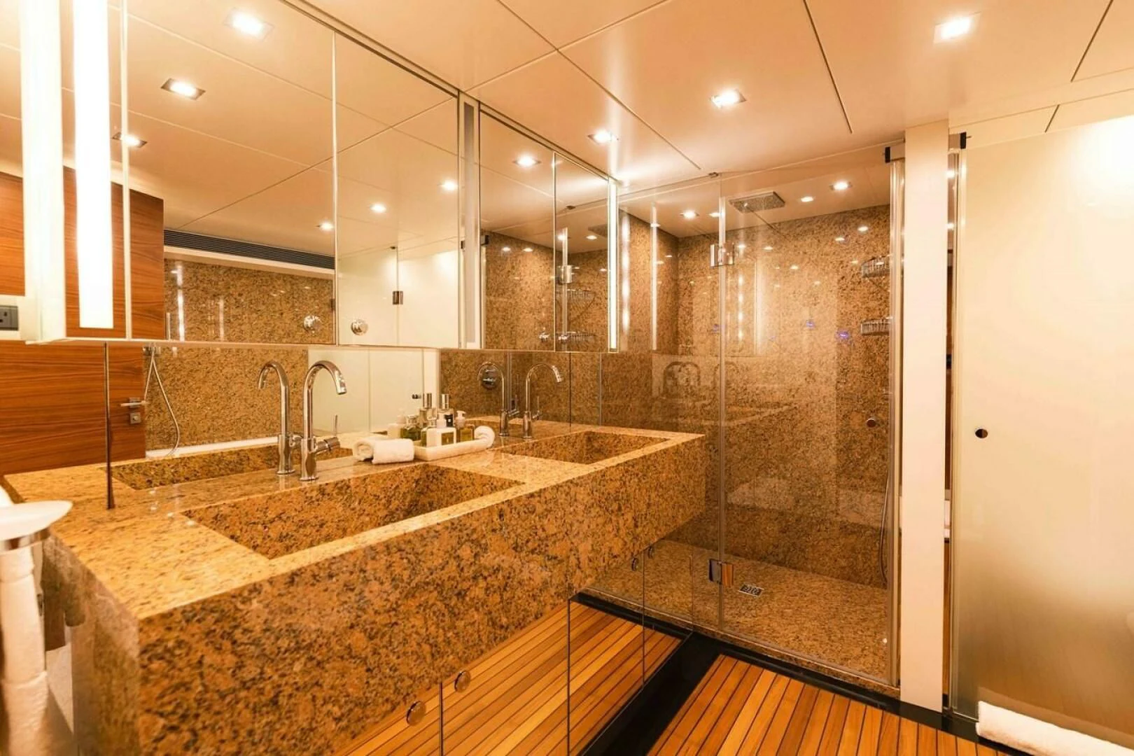 a bathroom with marble counter tops aboard SEA AXIS Yacht for Charter