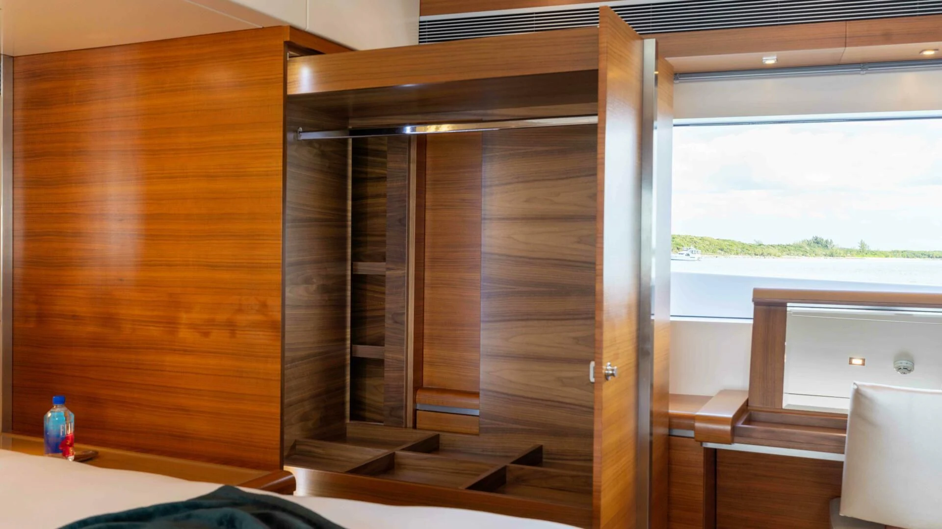 a room with a window and a desk aboard SEA AXIS Yacht for Charter