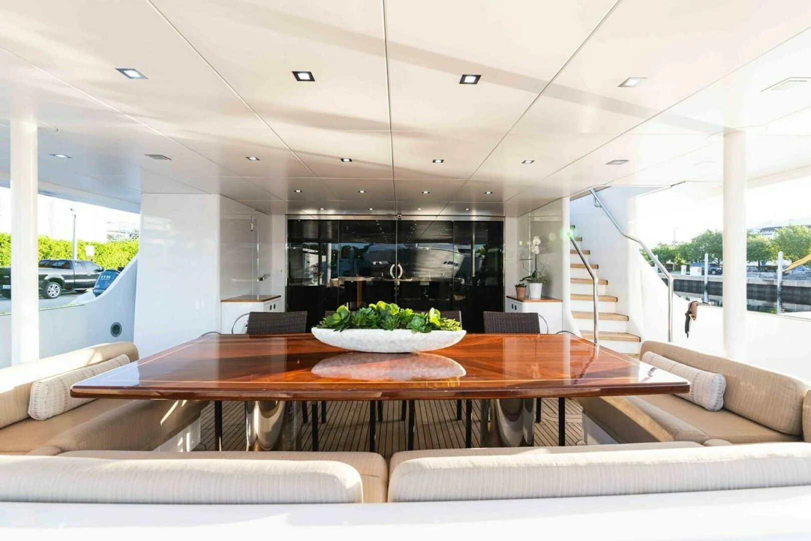 a large room with a table and chairs aboard SEA AXIS Yacht for Charter