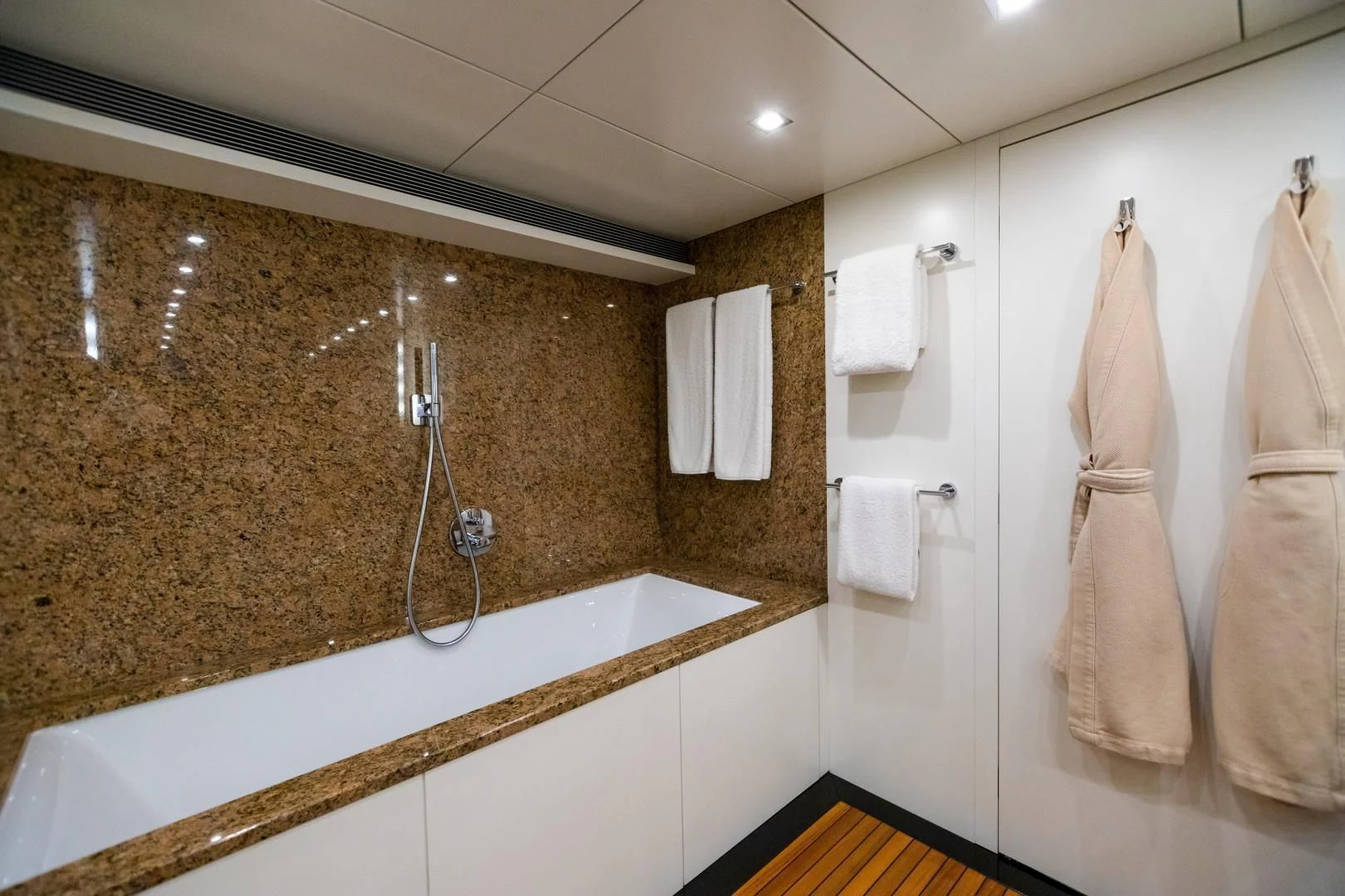 a bathroom with a marble countertop aboard SEA AXIS Yacht for Charter