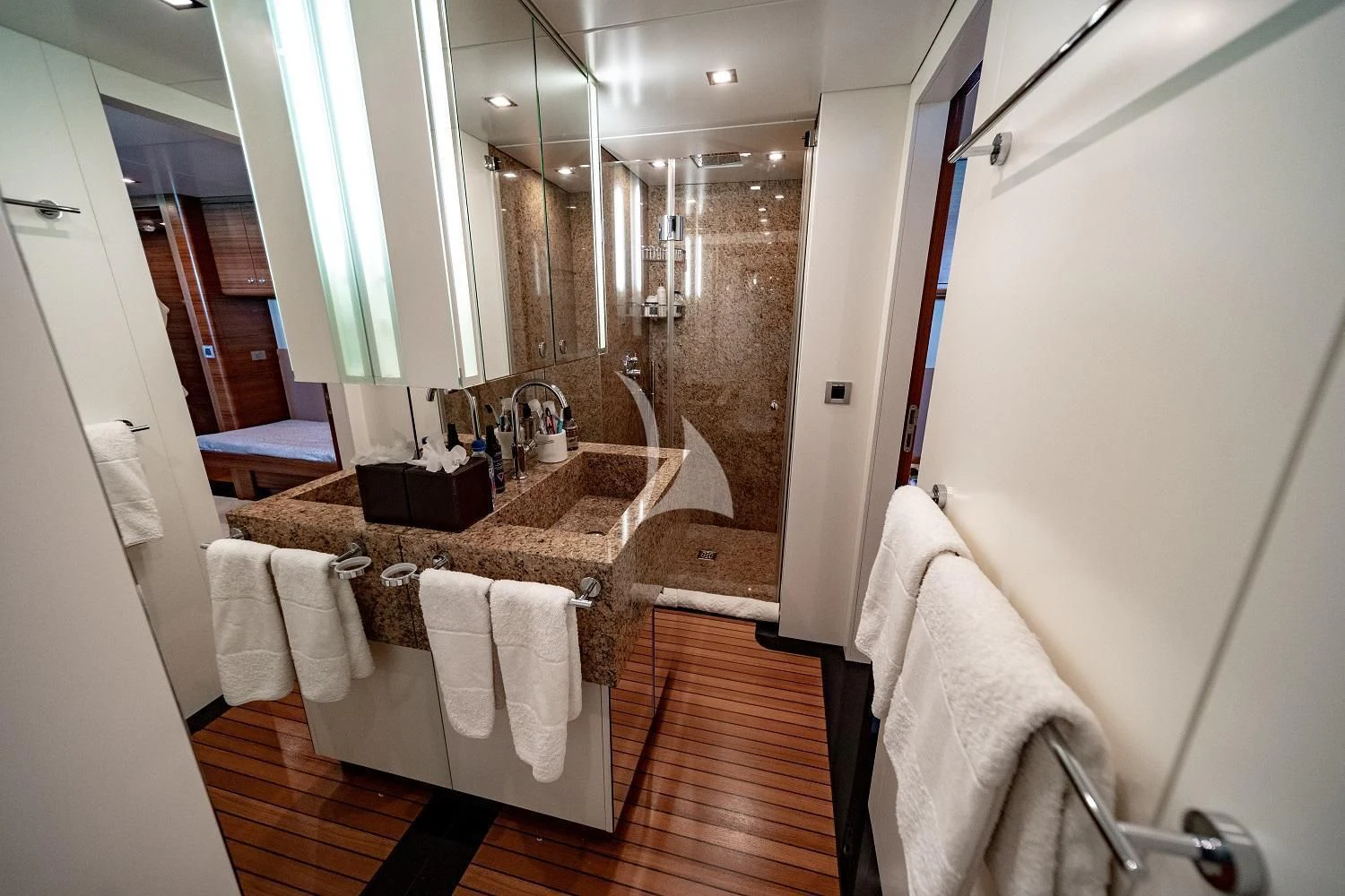 a bathroom with a large marble countertop aboard SEA AXIS Yacht for Charter