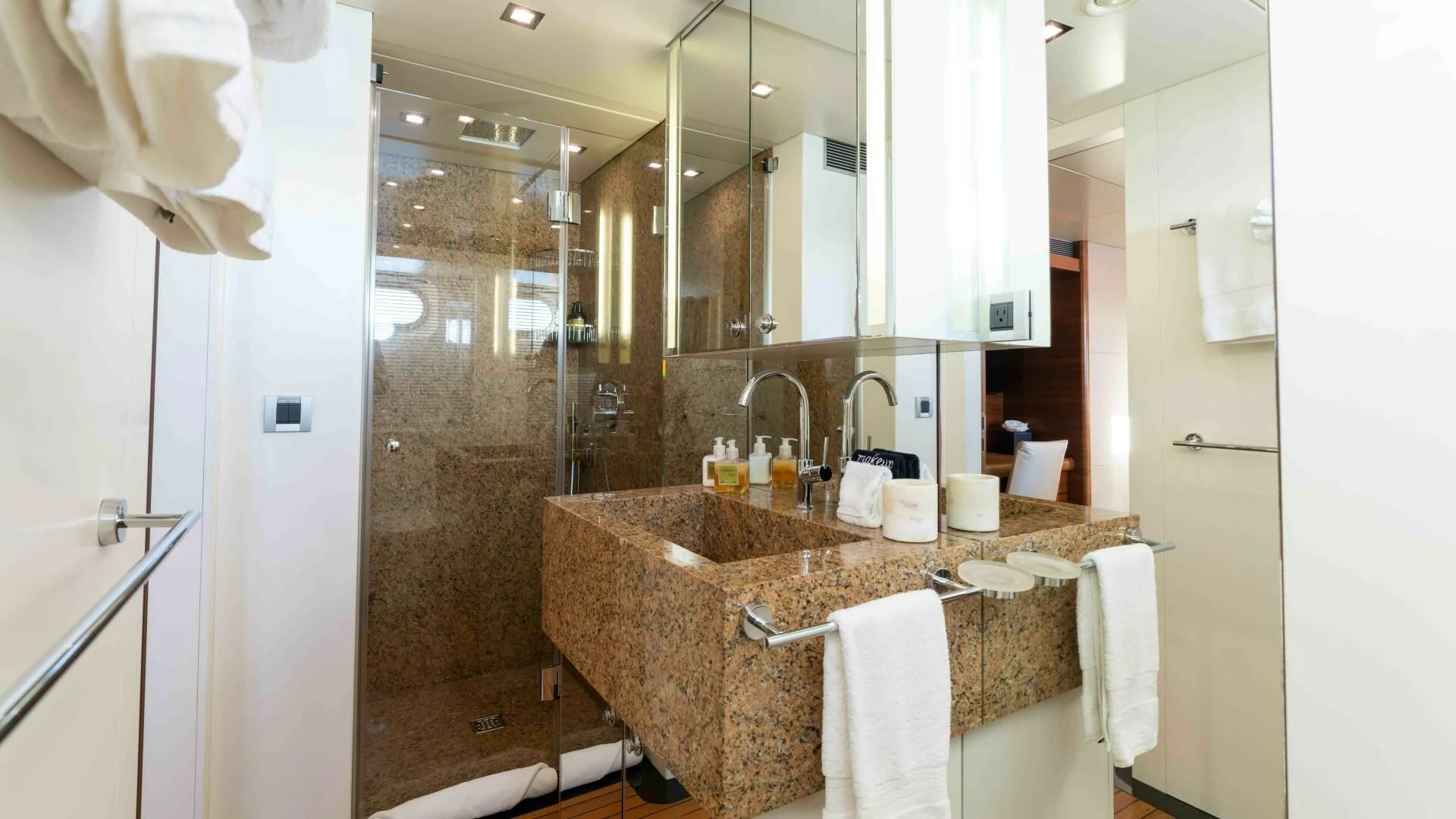 a bathroom with a large mirror aboard SEA AXIS Yacht for Charter