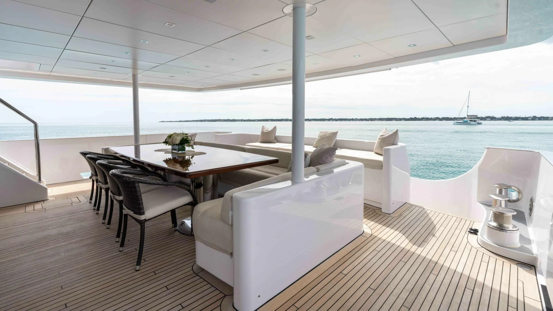 a room with a table and chairs aboard SEA AXIS Yacht for Charter