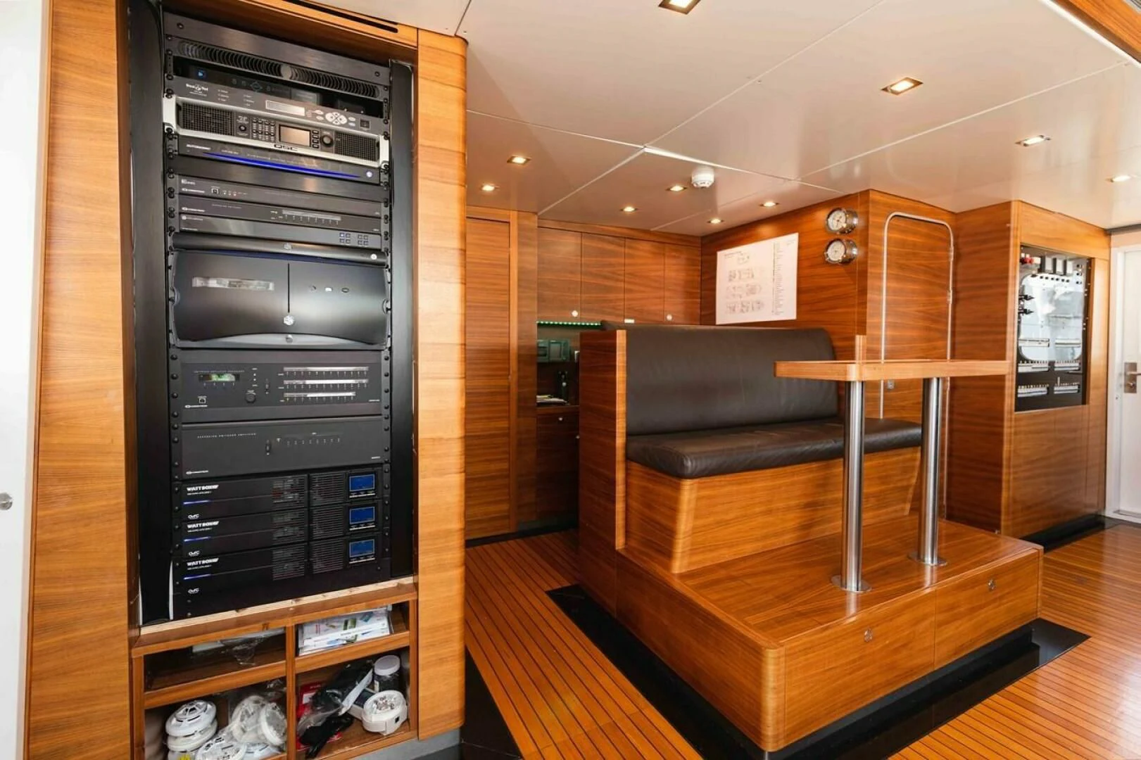 a room with a piano and a wood floor aboard SEA AXIS Yacht for Charter