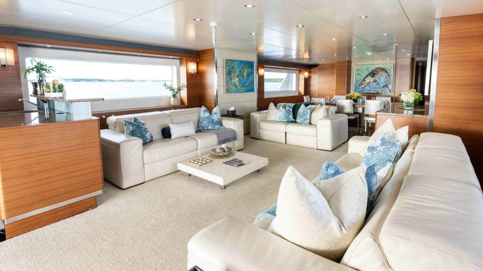 a living room with white couches aboard SEA AXIS Yacht for Charter