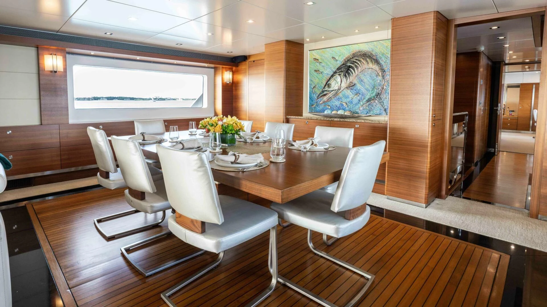 a conference room with a table and chairs aboard SEA AXIS Yacht for Charter