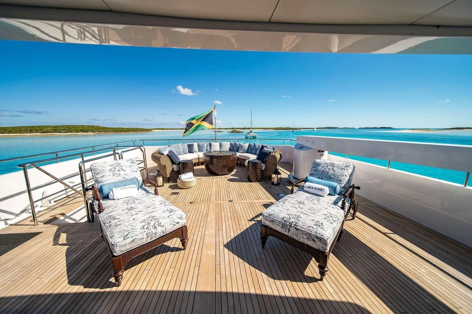 a deck with chairs and a pool aboard SEA AXIS Yacht for Charter