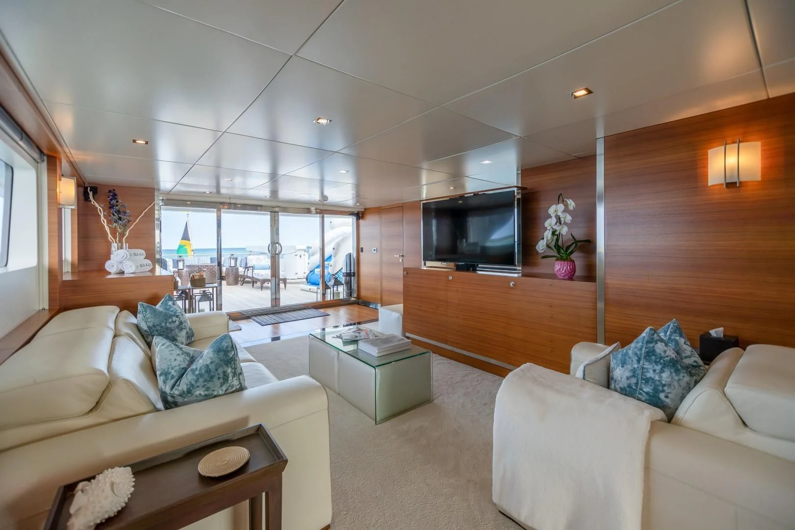 a living room with a large window aboard SEA AXIS Yacht for Charter