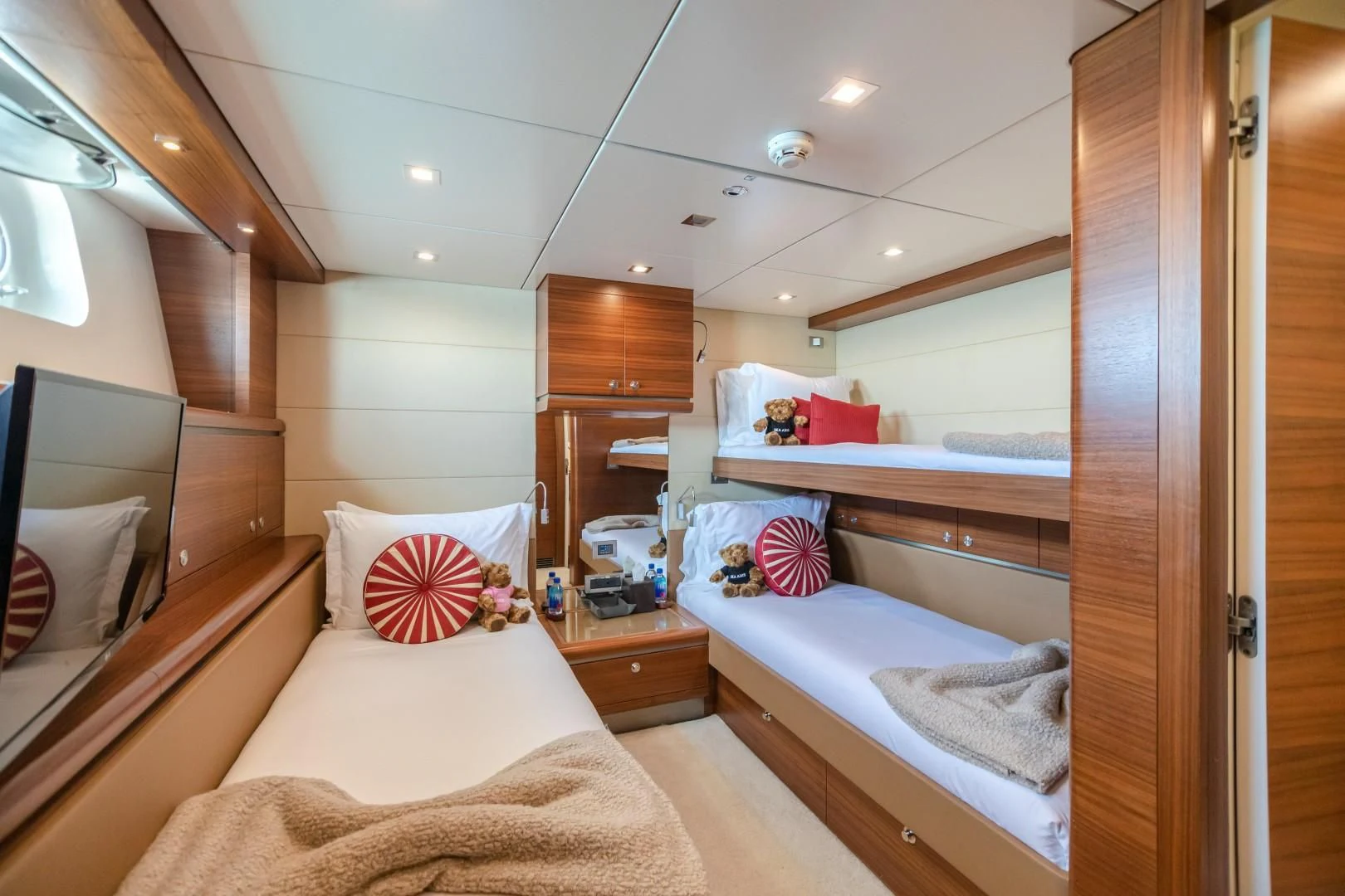 a room with a bed and a mirror aboard SEA AXIS Yacht for Charter