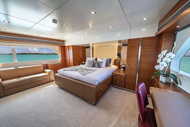 a bedroom with a bed and a pool aboard SEA AXIS Yacht for Charter
