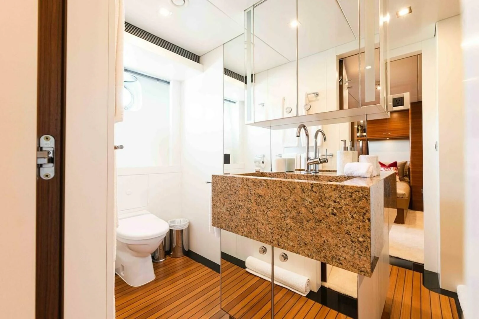 a bathroom with a sink and toilet aboard SEA AXIS Yacht for Charter