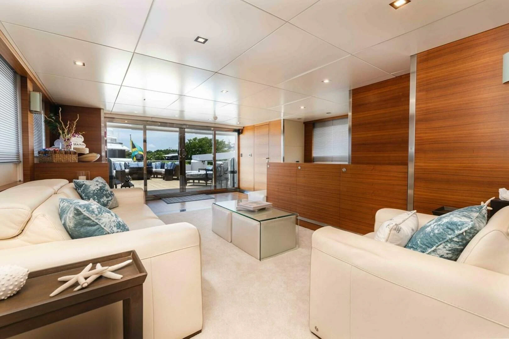 a living room with a large window aboard SEA AXIS Yacht for Charter