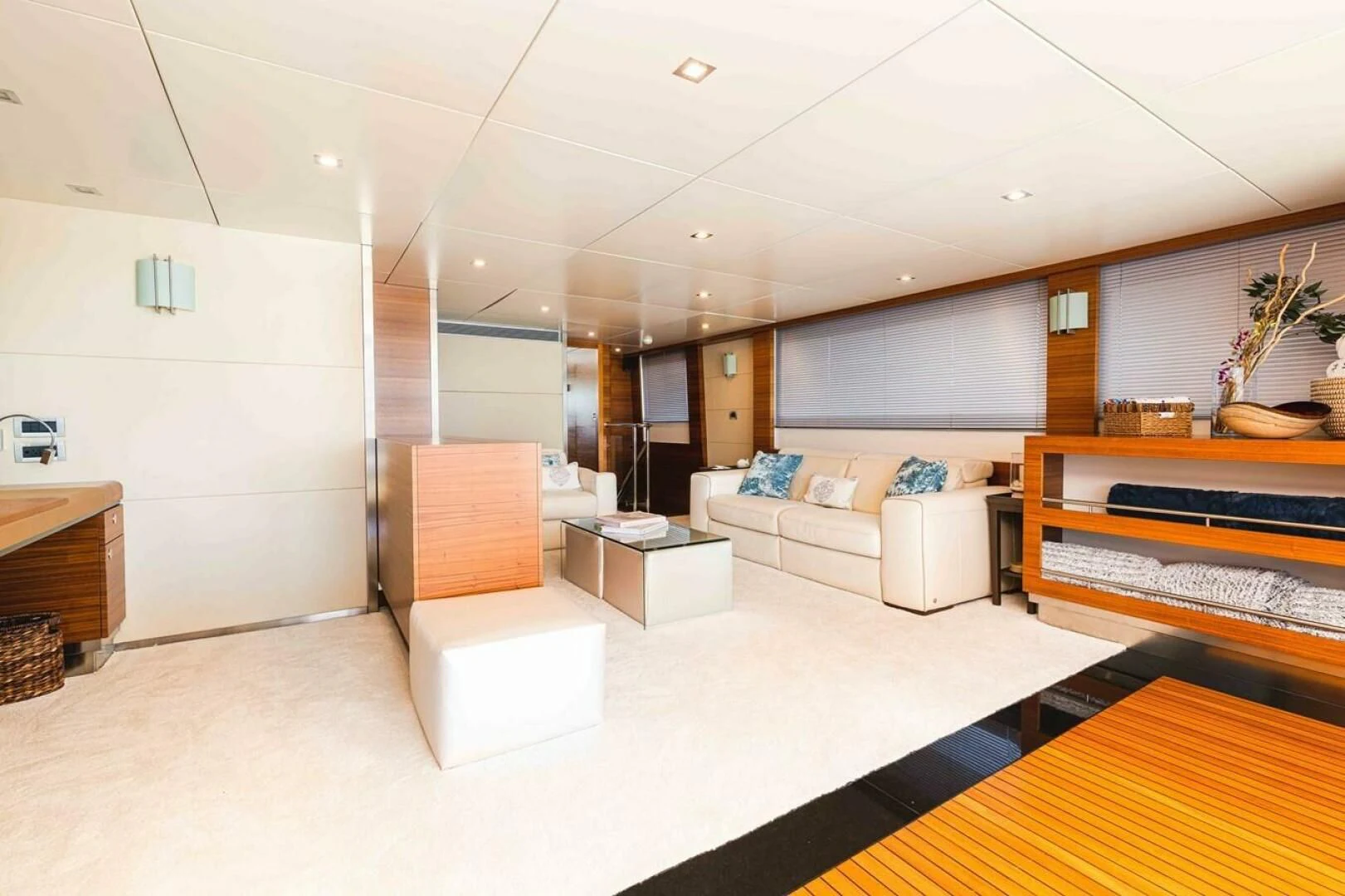 a room with white furniture aboard SEA AXIS Yacht for Charter