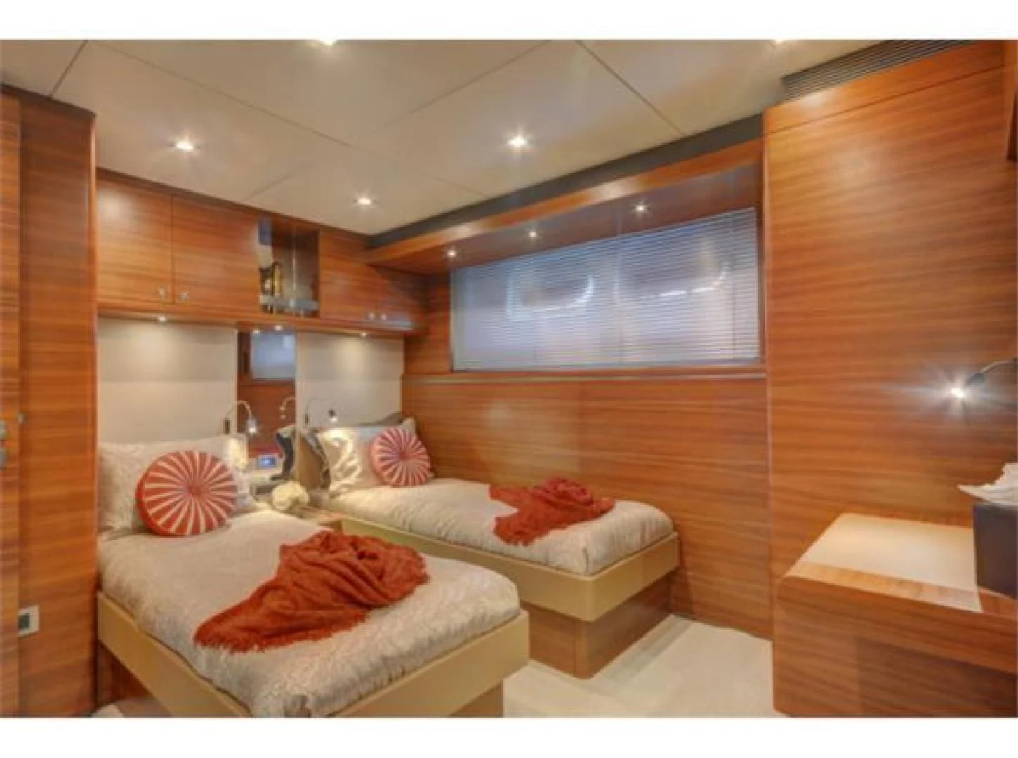 a room with a bed and a tv aboard SEA AXIS Yacht for Charter