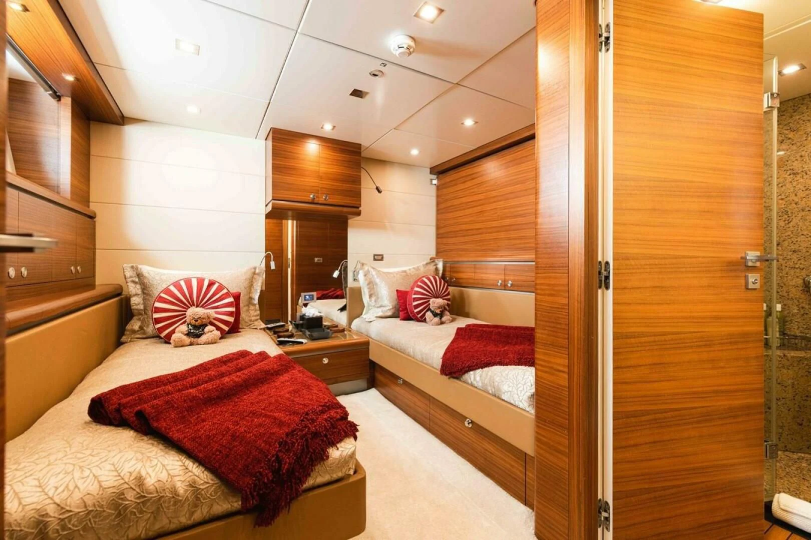 a room with a bed and a closet aboard SEA AXIS Yacht for Charter