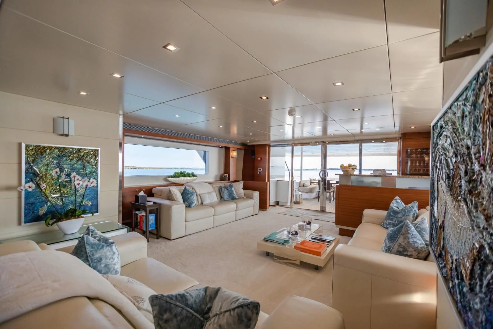 a living room with a large window aboard SEA AXIS Yacht for Charter