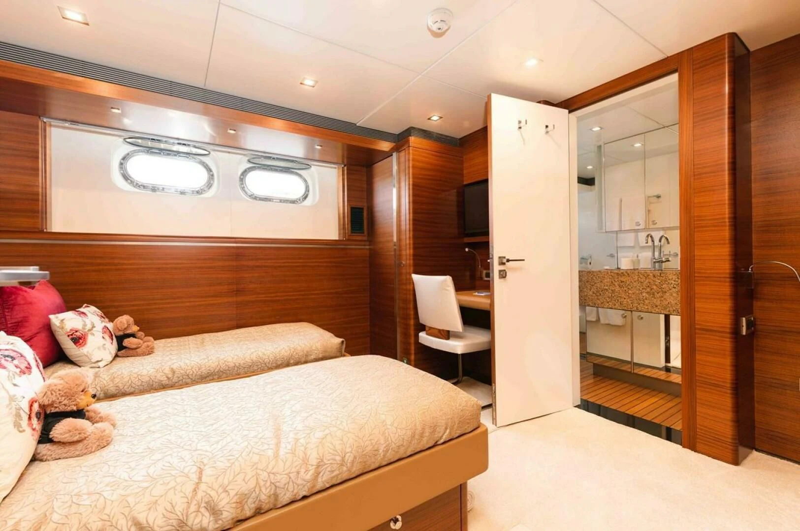 a room with a bed and a sink aboard SEA AXIS Yacht for Charter