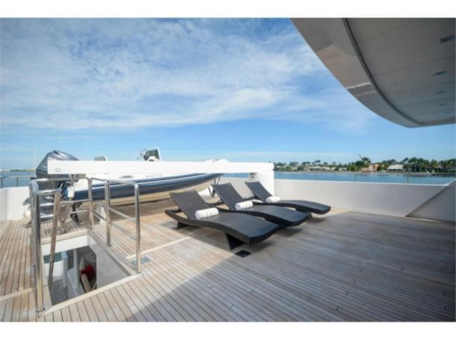 a deck with a couple of boats on it aboard SEA AXIS Yacht for Charter