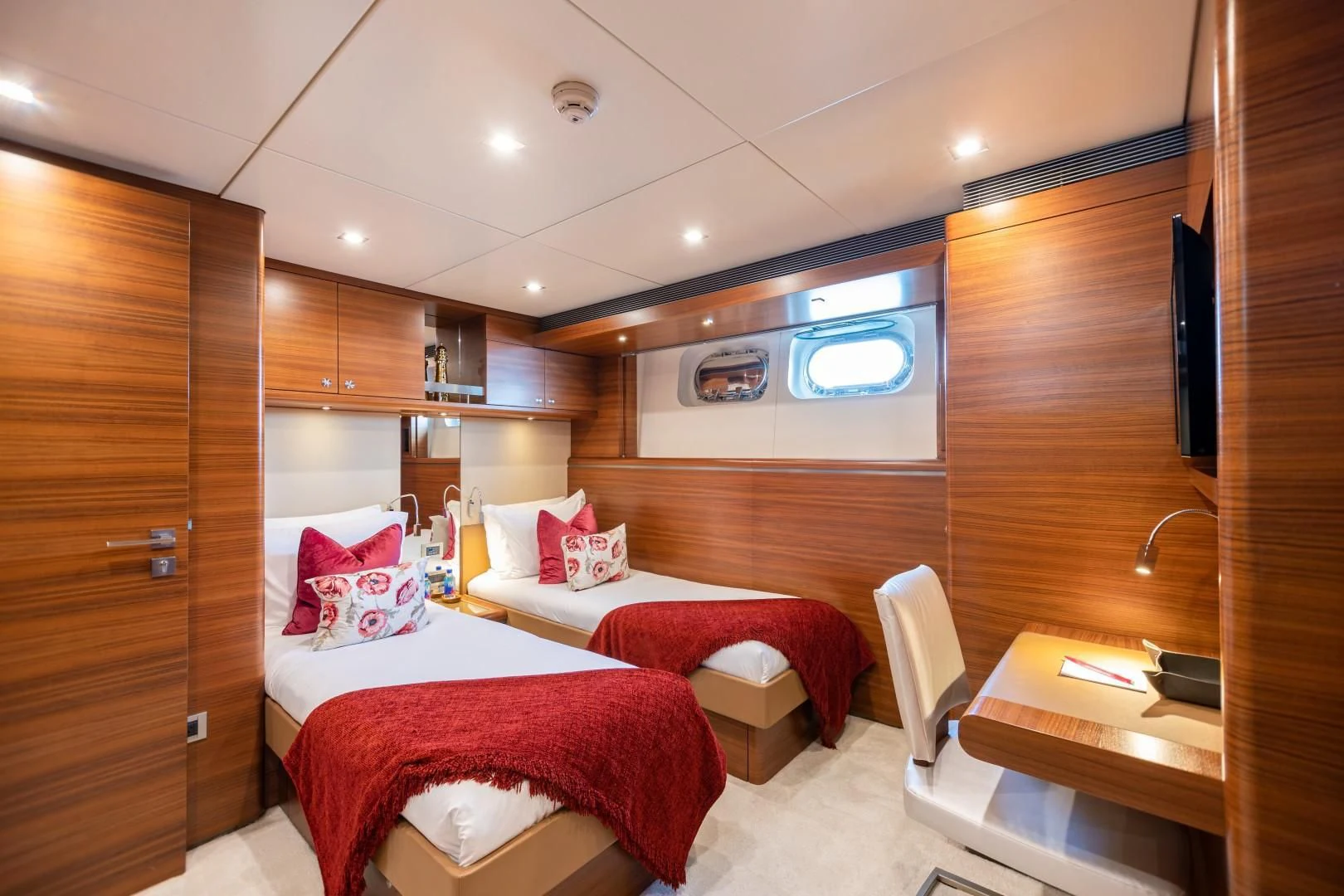 a room with a bed and a desk aboard SEA AXIS Yacht for Charter