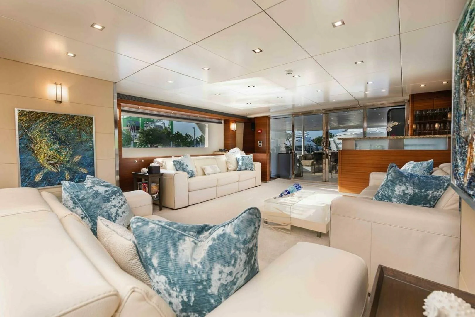 a living room with white couches aboard SEA AXIS Yacht for Charter