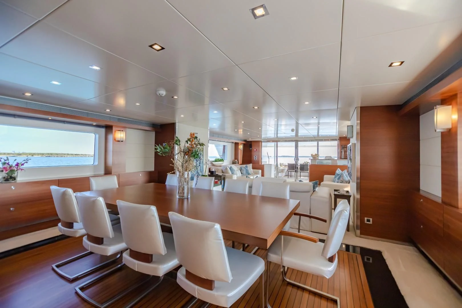 a room with tables and chairs aboard SEA AXIS Yacht for Charter