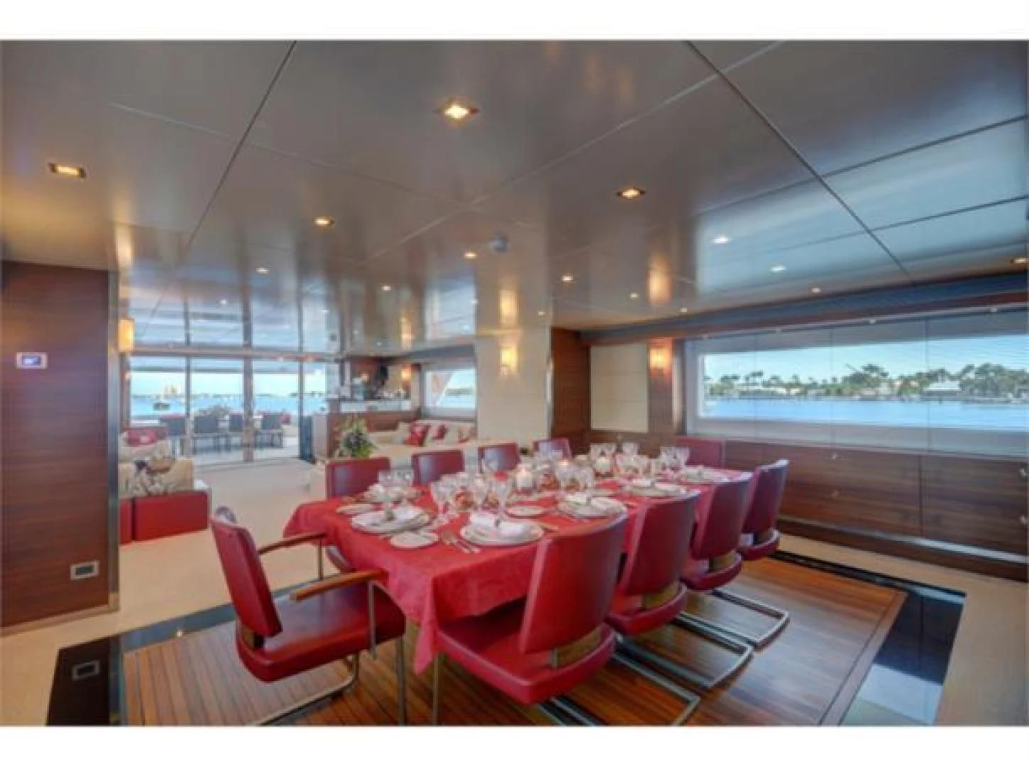 a restaurant with red tables and chairs aboard SEA AXIS Yacht for Charter