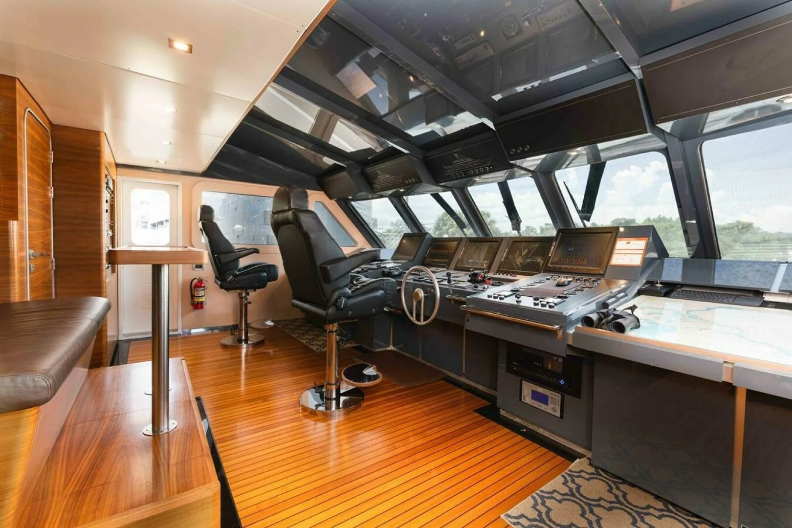 a room with a piano and a chair aboard SEA AXIS Yacht for Charter