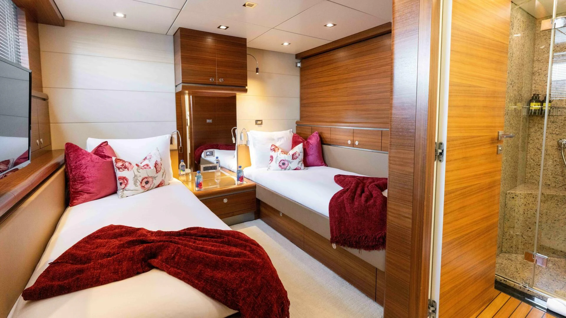 a room with a bed and a mirror aboard SEA AXIS Yacht for Charter