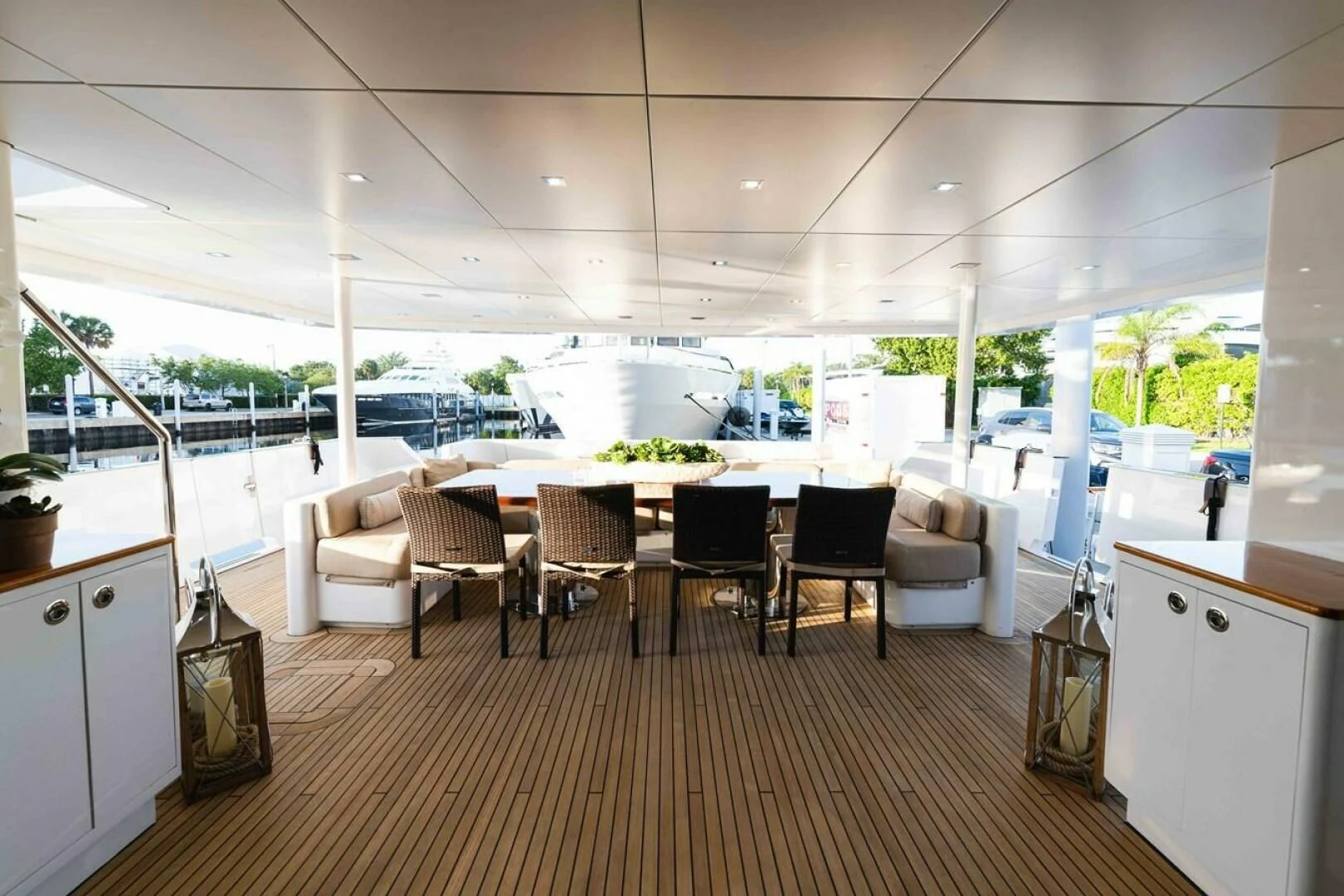 a room with a table chairs and a large window aboard SEA AXIS Yacht for Charter