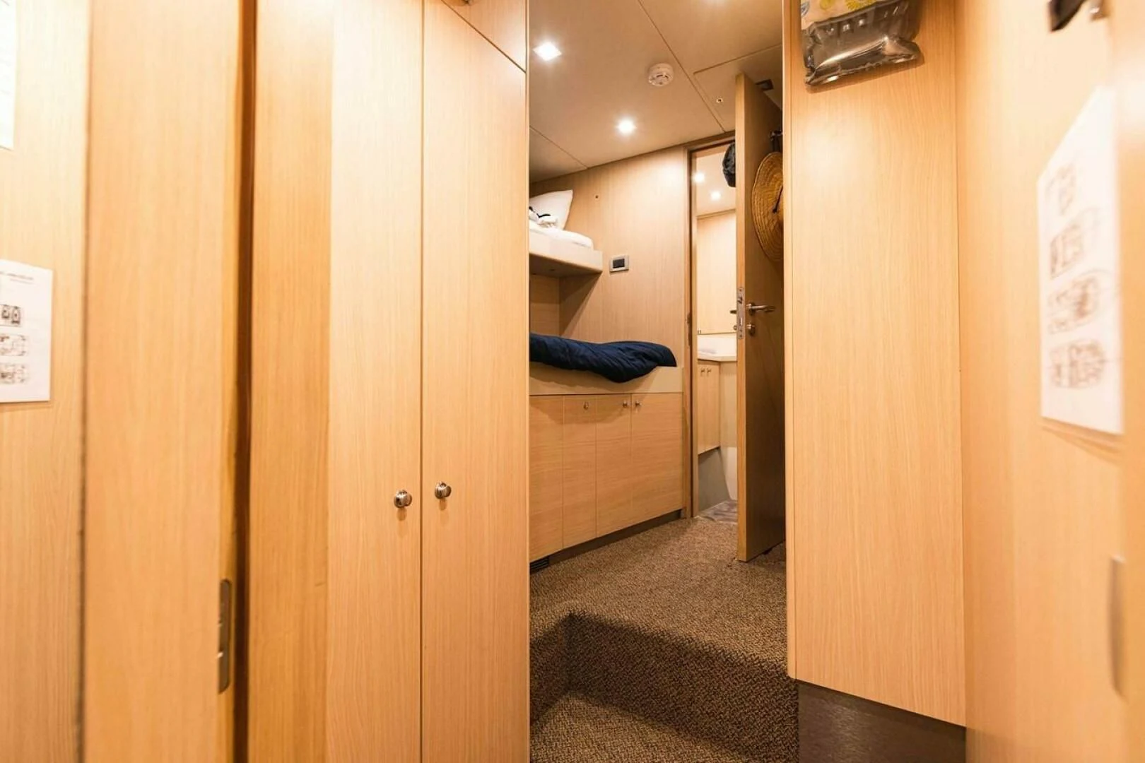 a room with wooden doors aboard SEA AXIS Yacht for Charter