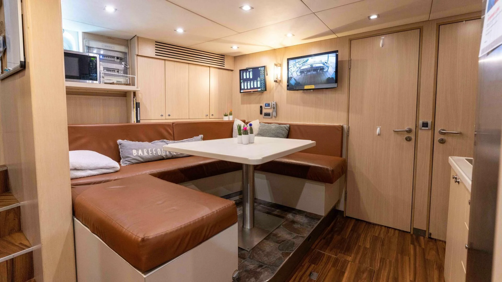 a room with a bed and a desk aboard SEA AXIS Yacht for Charter